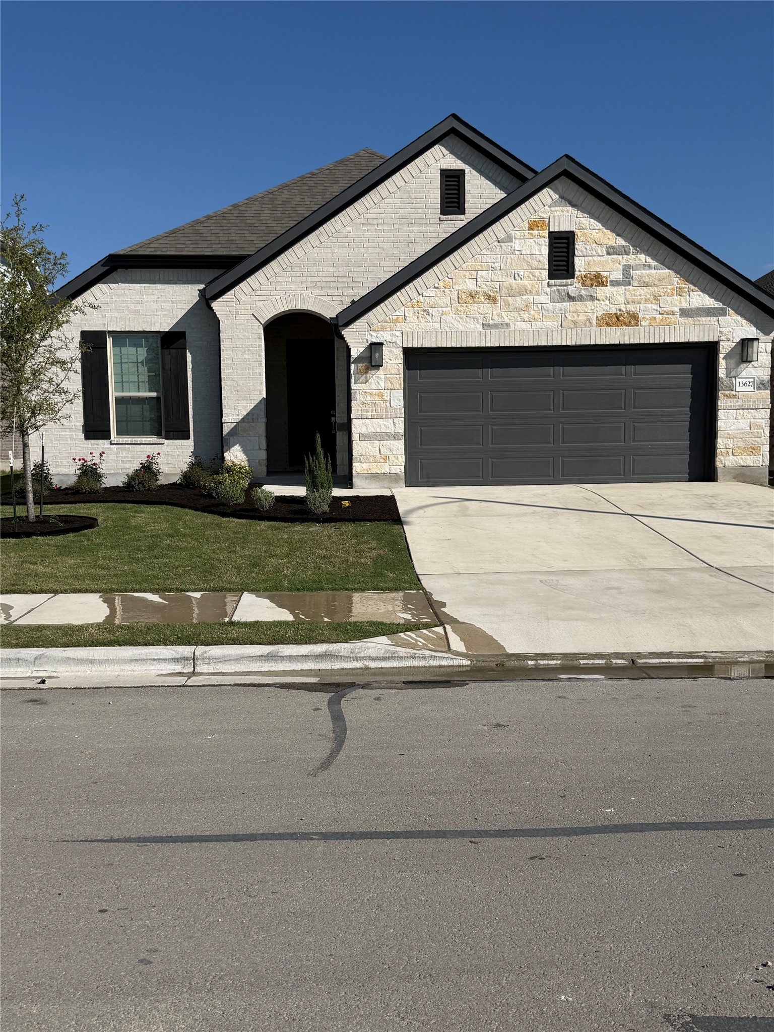 13627 Barn Chime Street Elgin, TX 78621 - Photo 1 of 14 Front of house