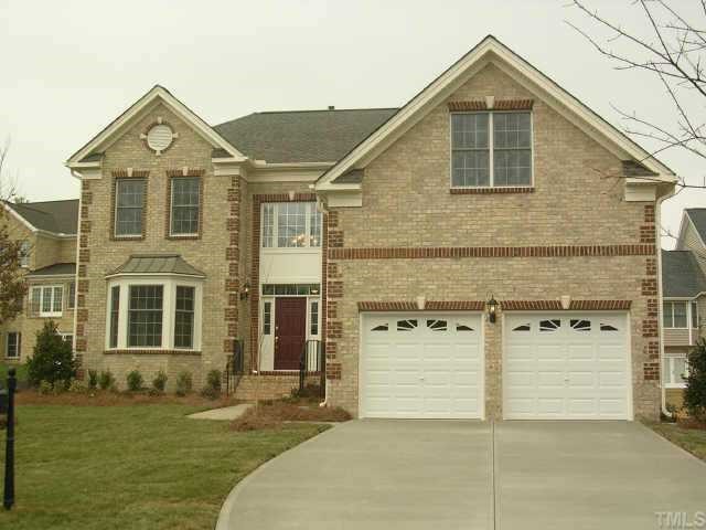 11726 Broadfield Court Raleigh, NC 27617 - Photo 1 of 6 a front view of a house with a yard