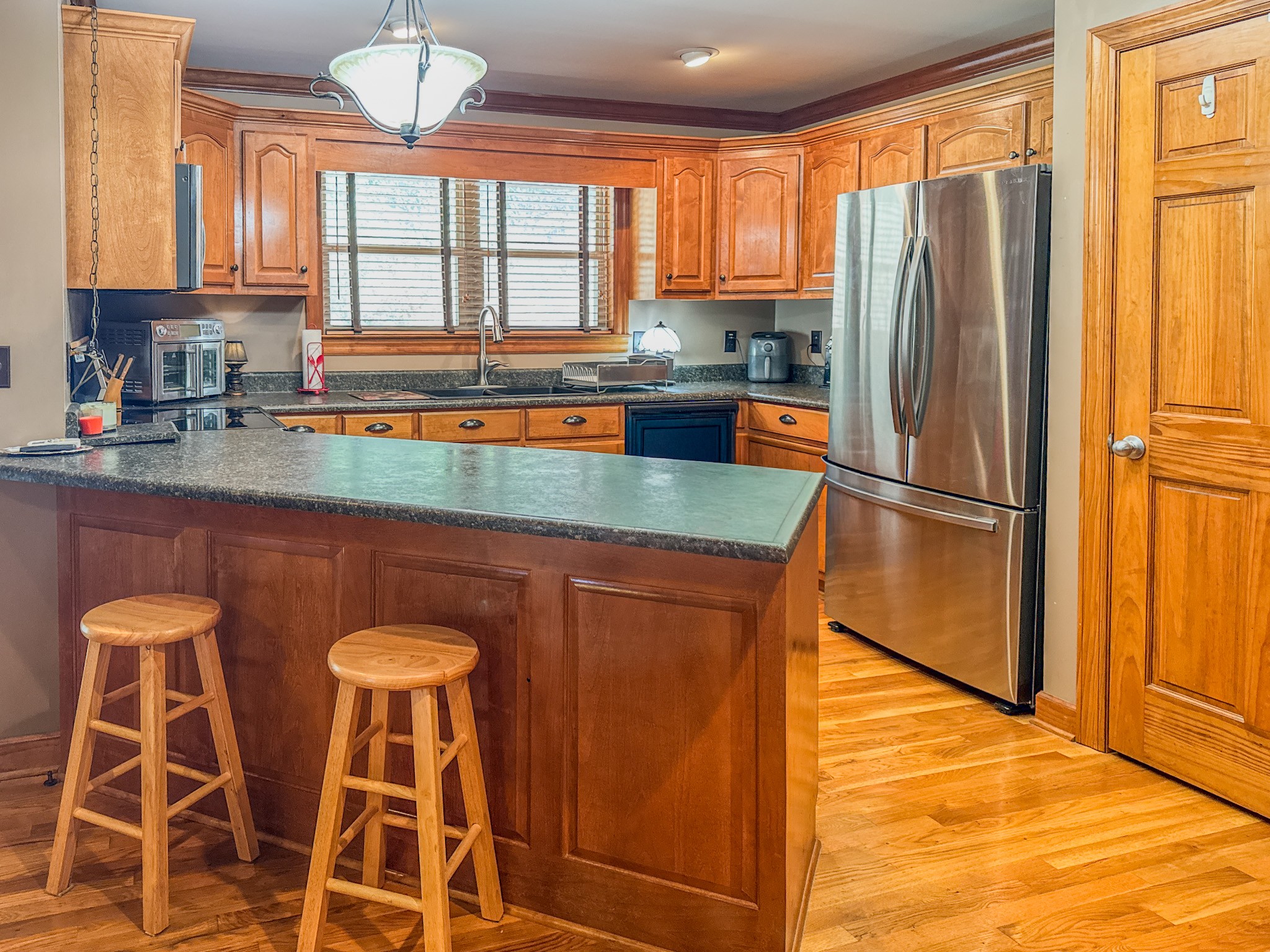 410 Britton Hollow Road Pulaski, TN 38478 - Photo 12 of 59 a kitchen with stainless steel appliances granite countertop a refrigerator and a sink