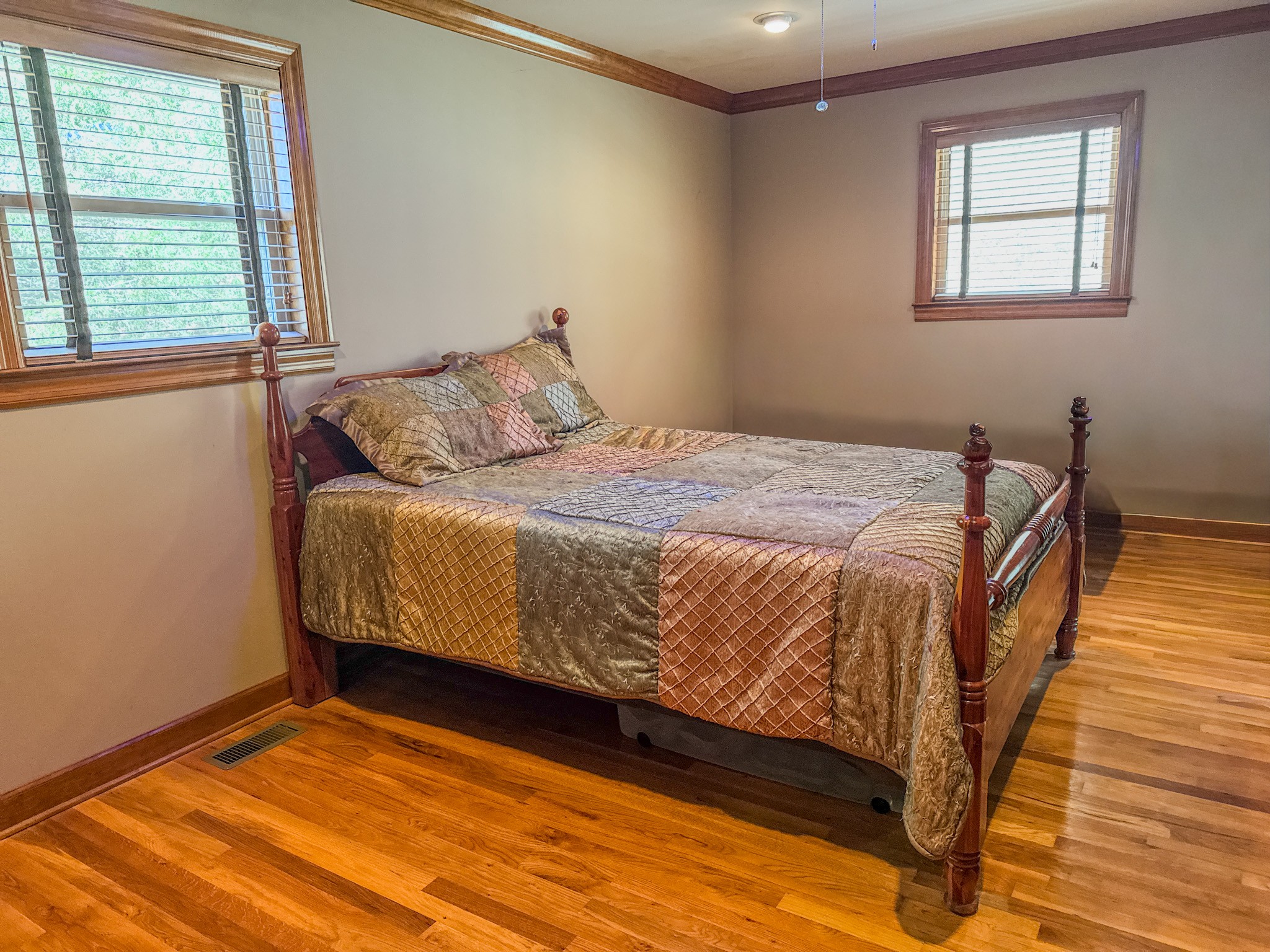 410 Britton Hollow Road Pulaski, TN 38478 - Photo 21 of 59 a bed sitting in a bedroom next to a window