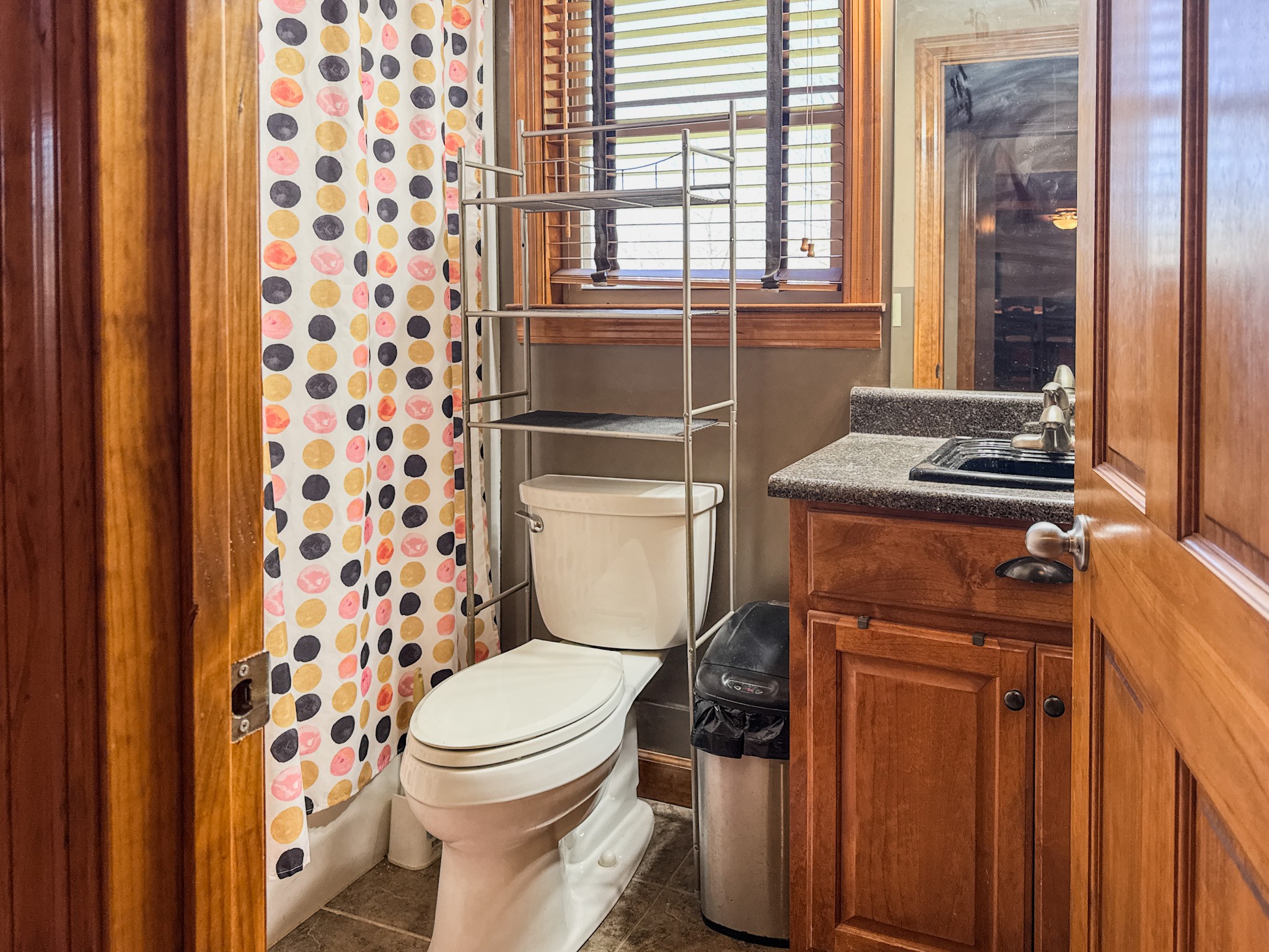 410 Britton Hollow Road Pulaski, TN 38478 - Photo 22 of 59 a bathroom with a toilet and a shower curtain