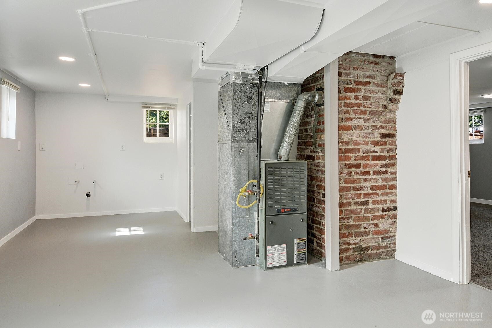 19330 20th Avenue Northwest Shoreline, WA 98177 - Photo 11 of 18 a view of water heater room with stairs
