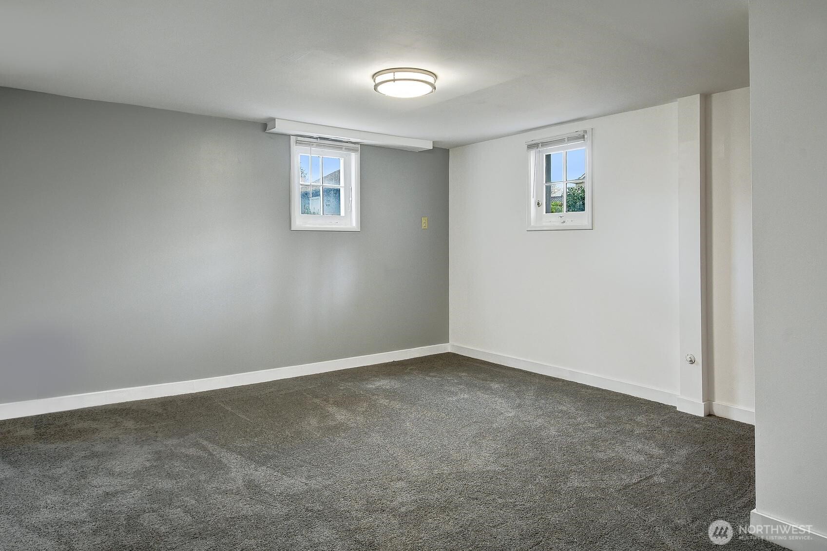 19330 20th Avenue Northwest Shoreline, WA 98177 - Photo 12 of 18 an empty room with windows
