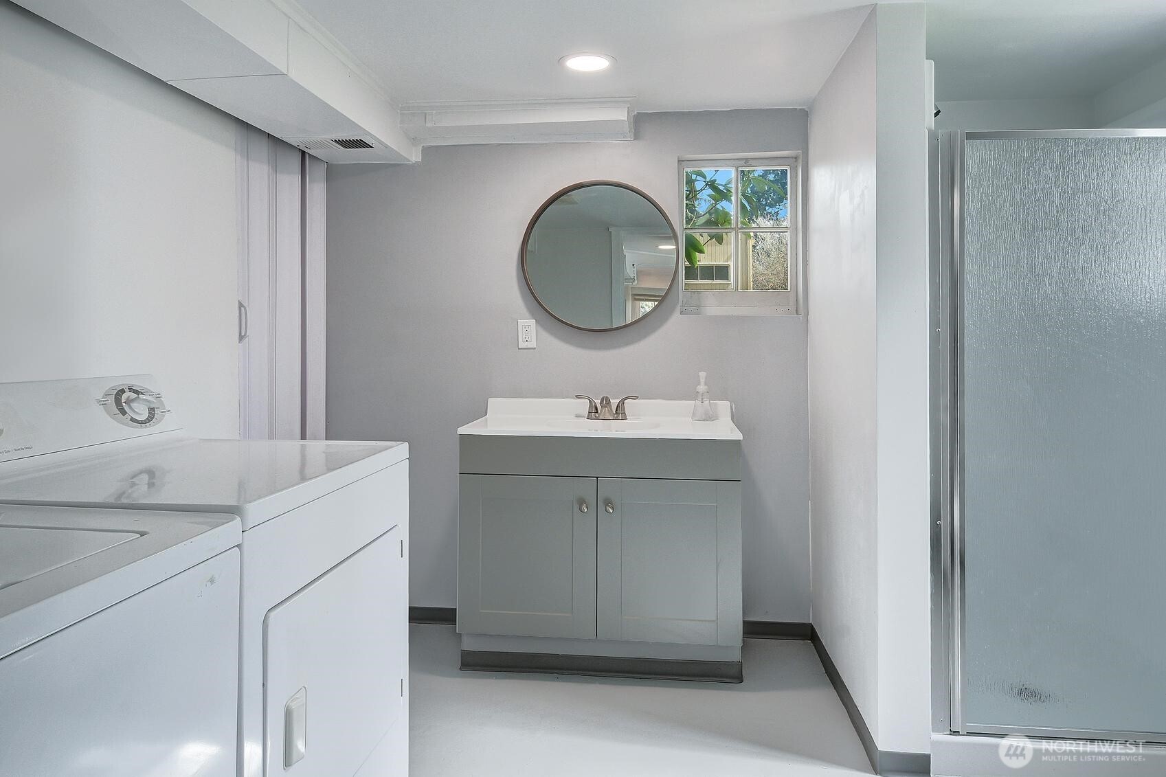 19330 20th Avenue Northwest Shoreline, WA 98177 - Photo 13 of 18 a bathroom with a sink vanity and mirror