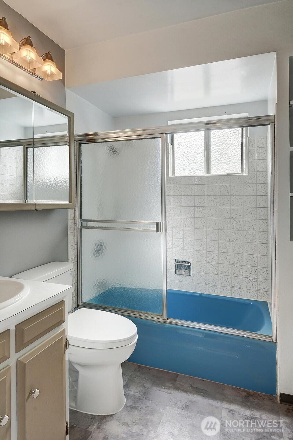 19330 20th Avenue Northwest Shoreline, WA 98177 - Photo 8 of 18 a bathroom with a toilet a sink and a shower