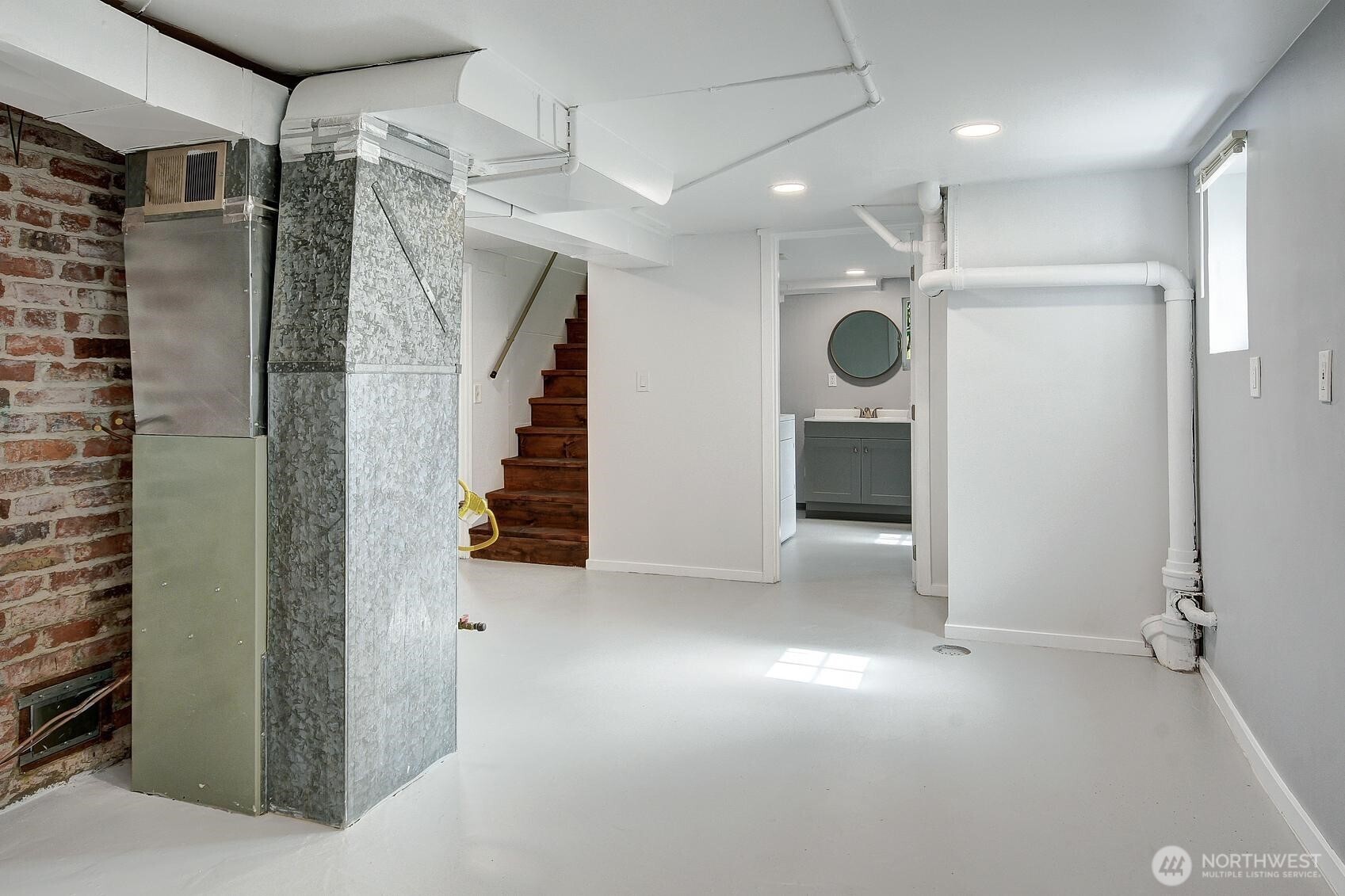 19330 20th Avenue Northwest Shoreline, WA 98177 - Photo 10 of 18 a view of an empty room with wooden floor and entryway
