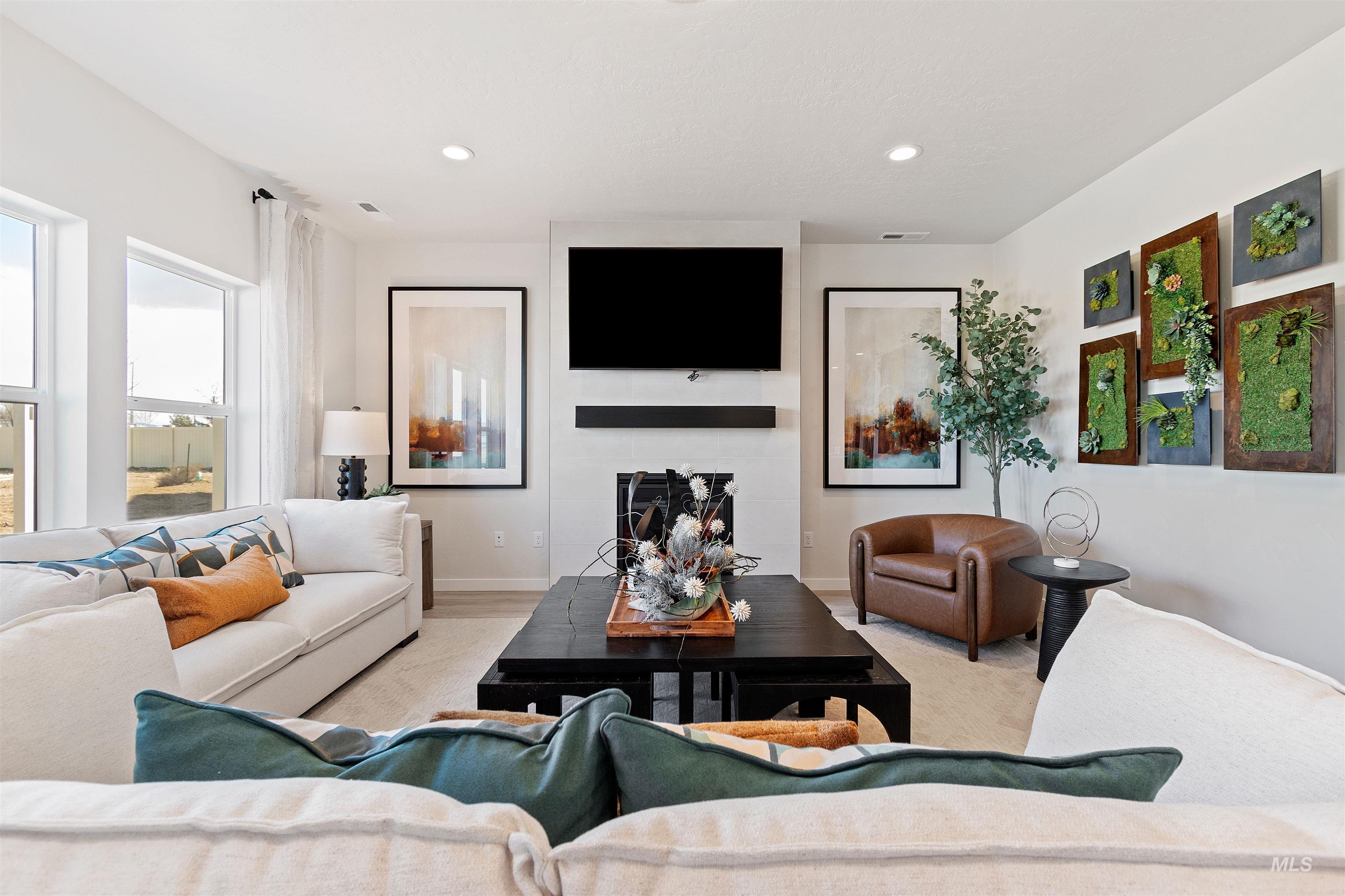 222 Omphale Street West Kuna, ID 83634 - Photo 2 of 11 Living area featuring recessed lighting and a large fireplace