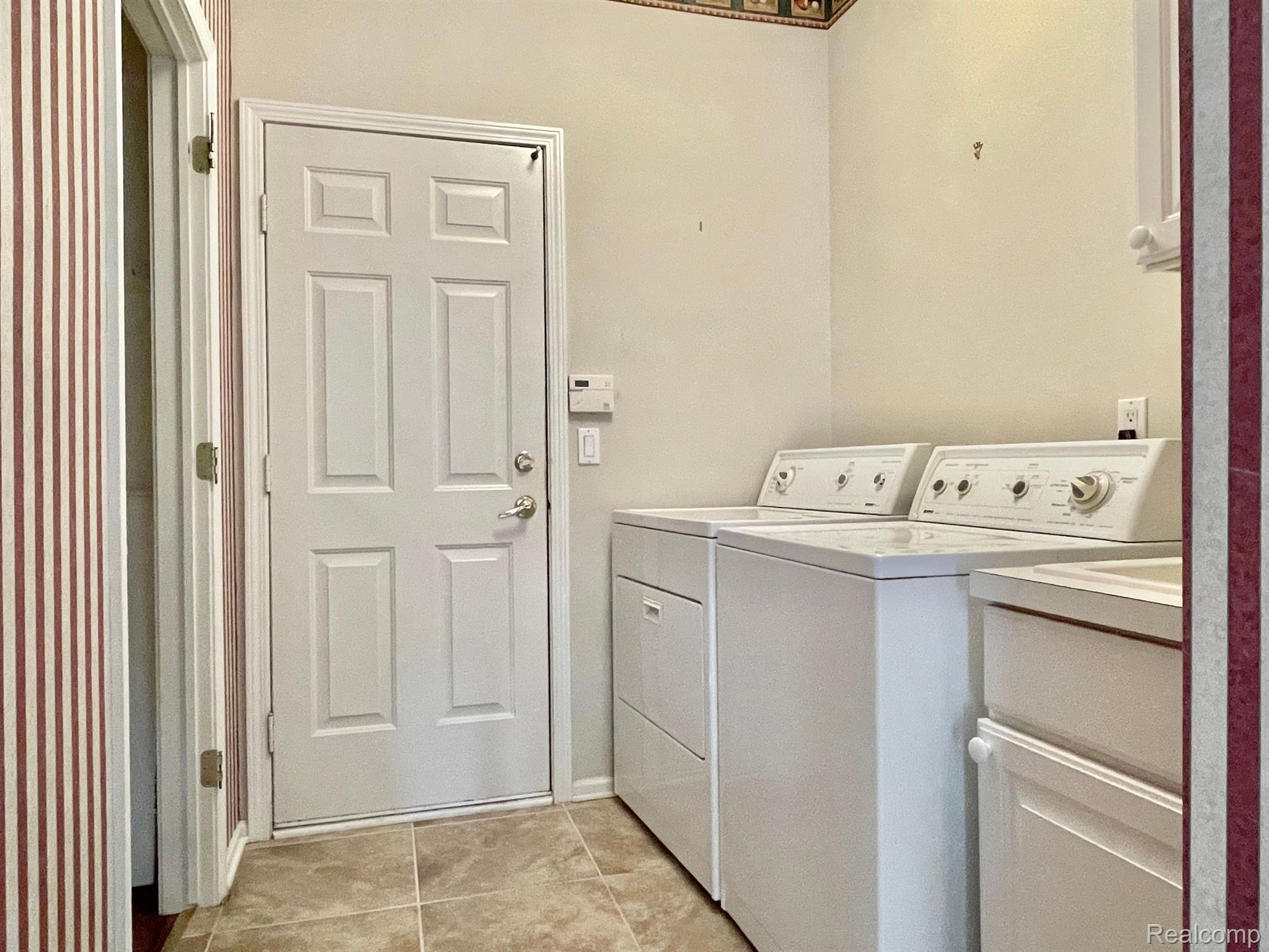 1630 Boulder Court Rochester, MI 48306 - Photo 25 of 40 Main floor laundry room, door to garage