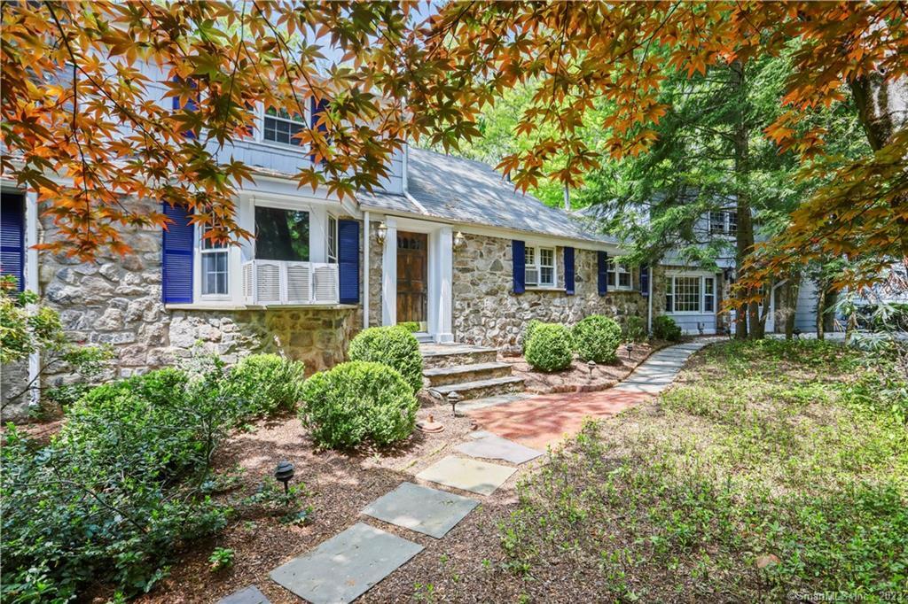 56 Clover Drive Wilton, CT 06897 - Photo 1 of 1 a front view of a house with garden