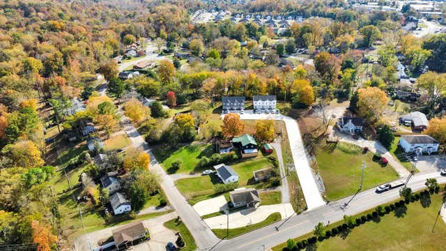 an aerial view of residential houses with outdoor space
