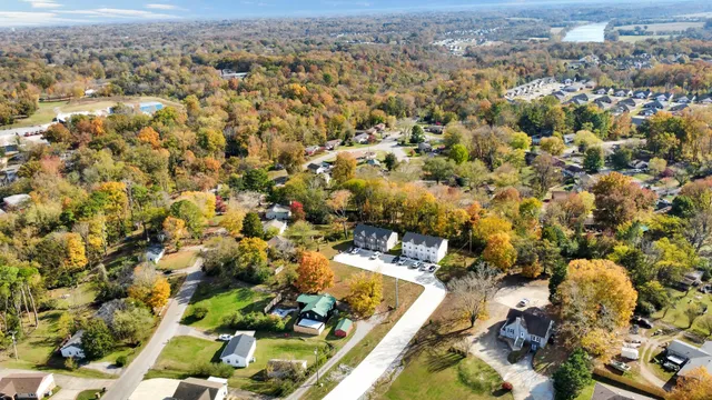 a view of a house with a yard and sitting area
