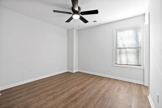 a bathroom with a sink toilet vanity and tub