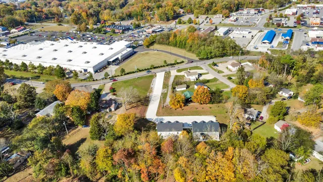 a view of a swimming pool with a yard