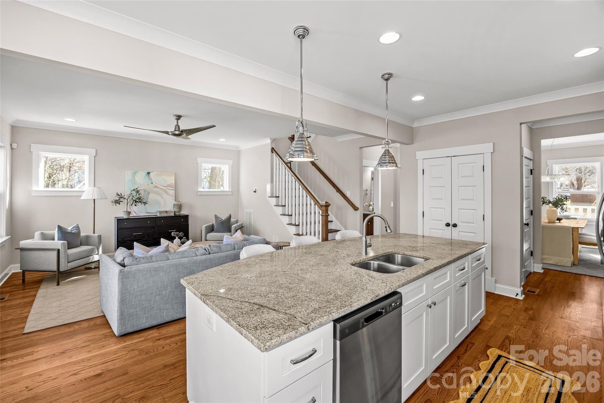 1728 Burgin Street Charlotte, NC 28205 - Photo 14 of 43 a kitchen with sink cabinets and wooden floor