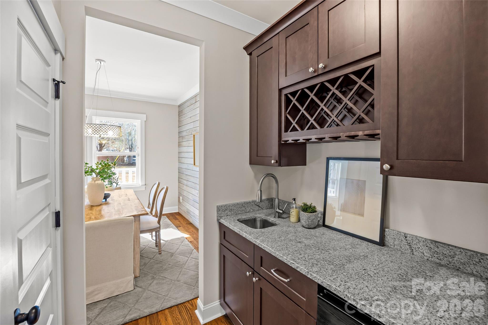 1728 Burgin Street Charlotte, NC 28205 - Photo 15 of 43 a kitchen with granite countertop a sink stainless steel appliances a counter space and cabinets