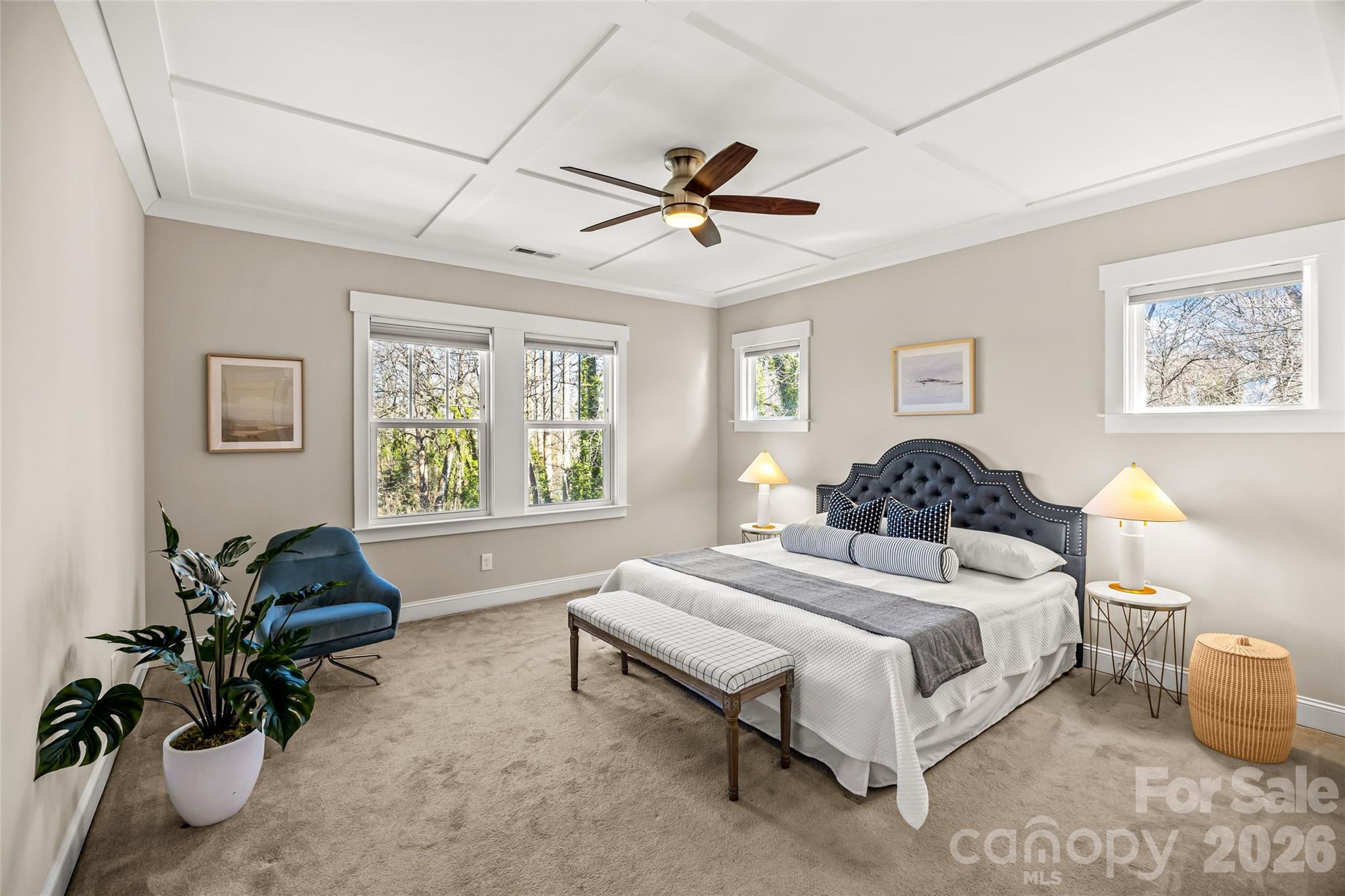 1728 Burgin Street Charlotte, NC 28205 - Photo 23 of 43 a spacious bedroom with a bed and a chandelier