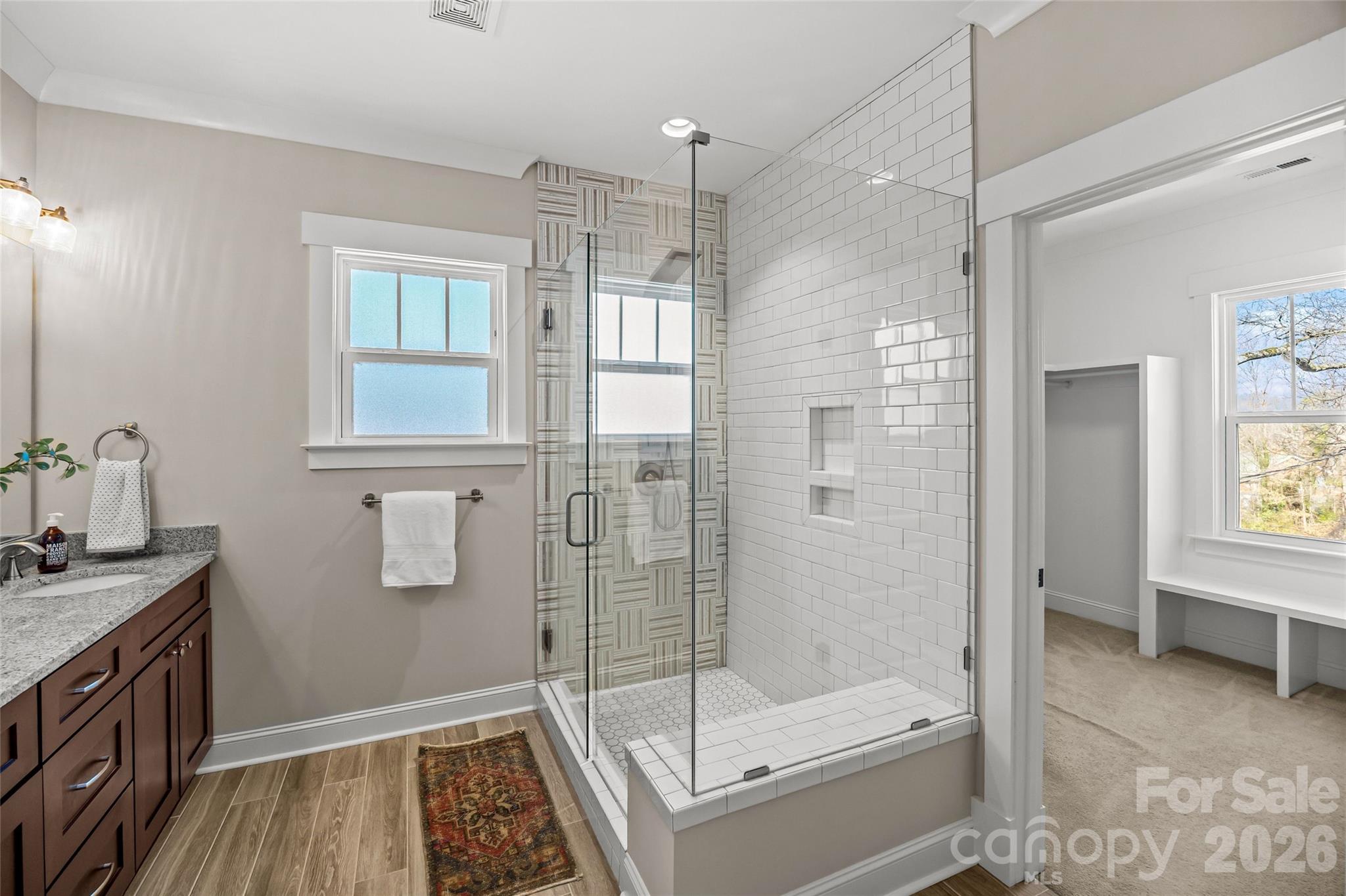 1728 Burgin Street Charlotte, NC 28205 - Photo 25 of 43 a bathroom with a tub shower vanity and a sink