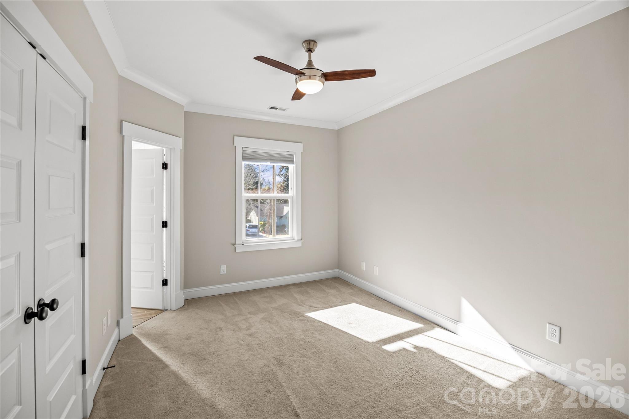1728 Burgin Street Charlotte, NC 28205 - Photo 29 of 43 a view of a livingroom with a ceiling fan & window
