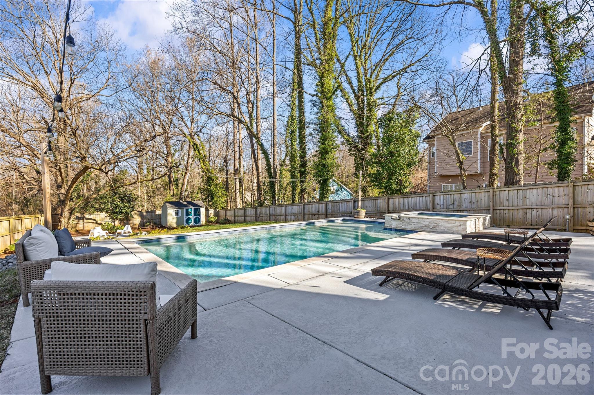 1728 Burgin Street Charlotte, NC 28205 - Photo 33 of 43 a view of a patio with couches and a fire pit