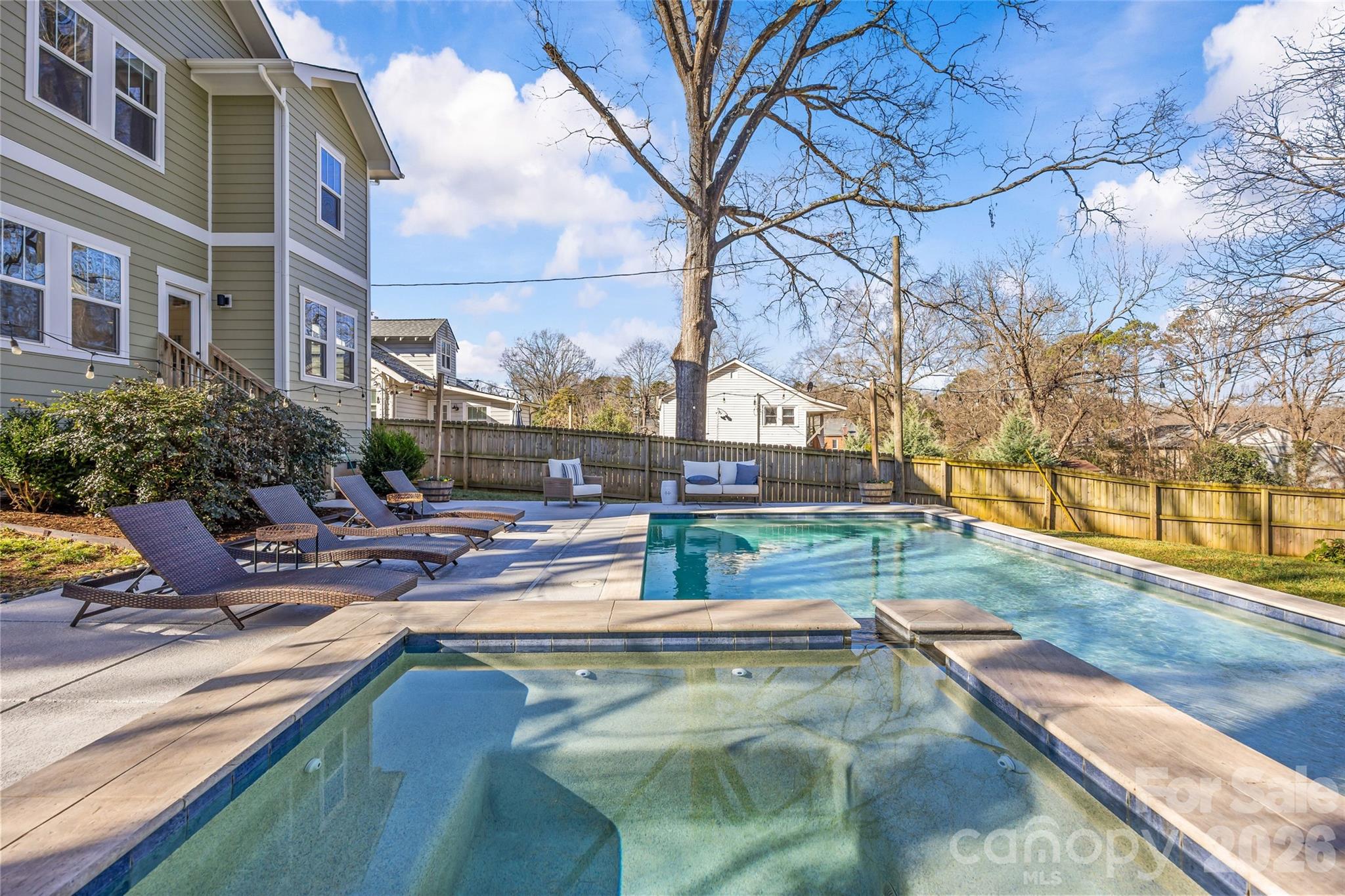 1728 Burgin Street Charlotte, NC 28205 - Photo 34 of 43 a view of a swimming pool with a lounge chairs