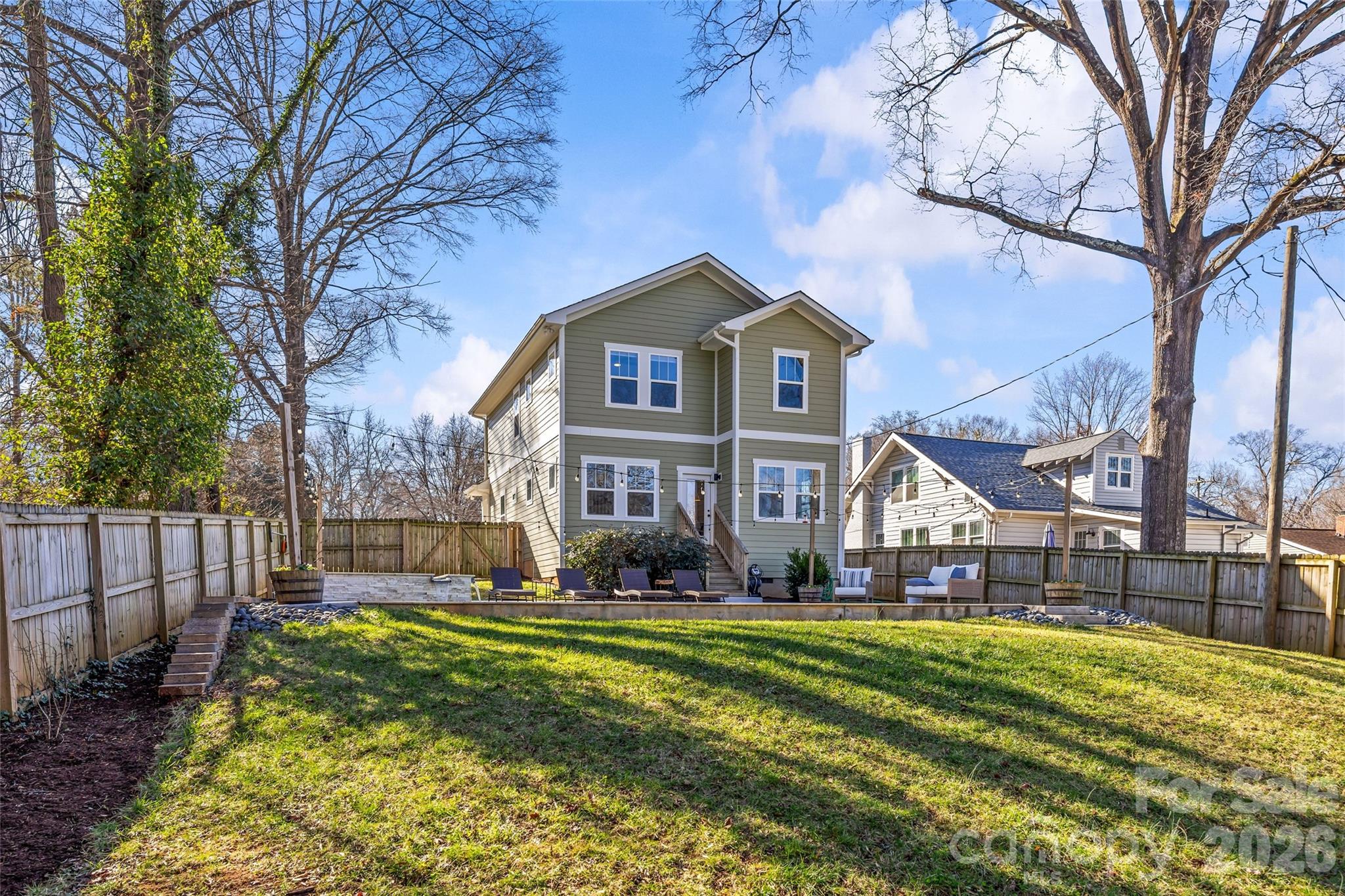 1728 Burgin Street Charlotte, NC 28205 - Photo 39 of 43 a front view of a house with a yard table and chairs