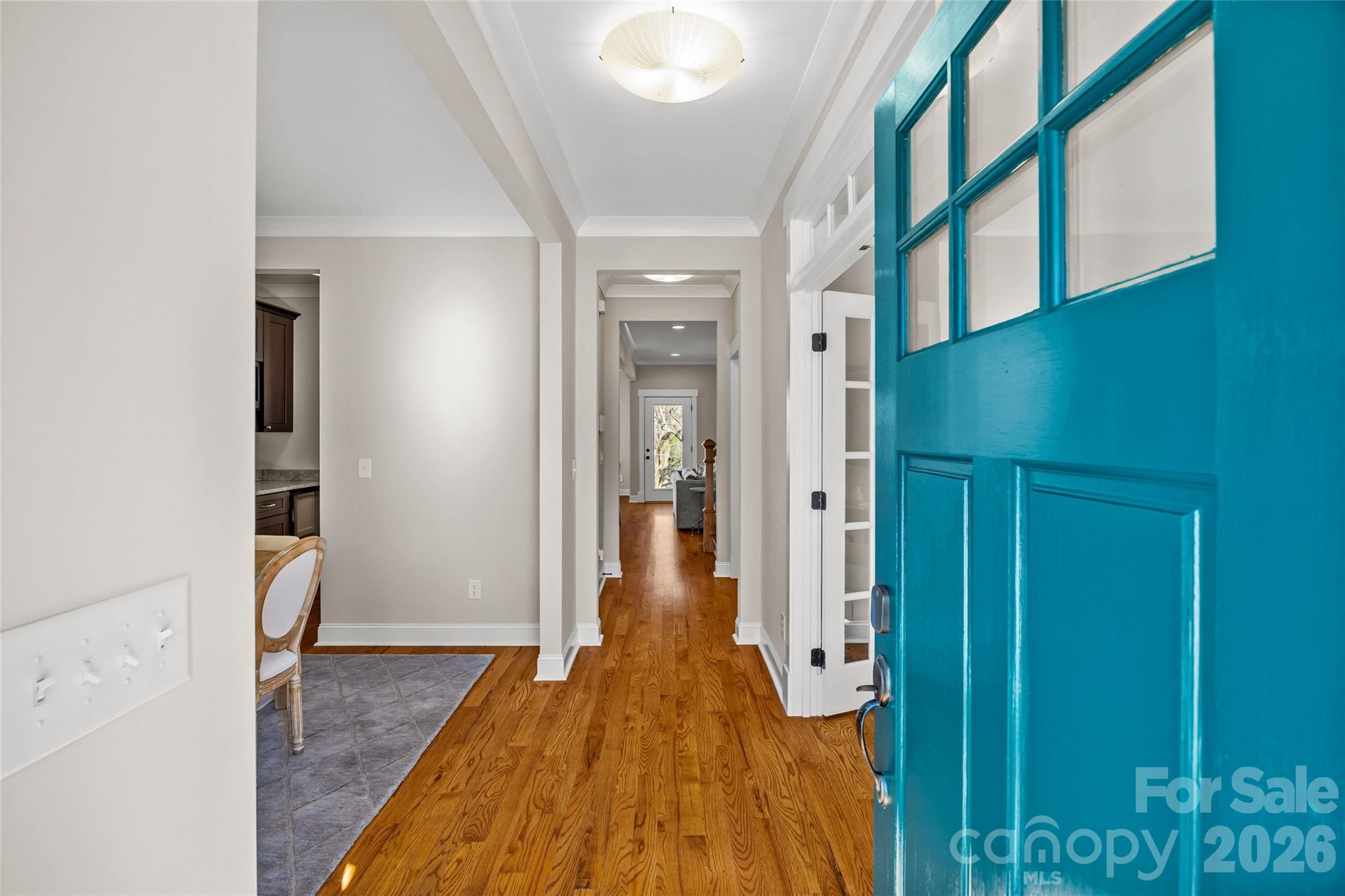 1728 Burgin Street Charlotte, NC 28205 - Photo 4 of 43 a view of a hallway with wooden floor and staircase