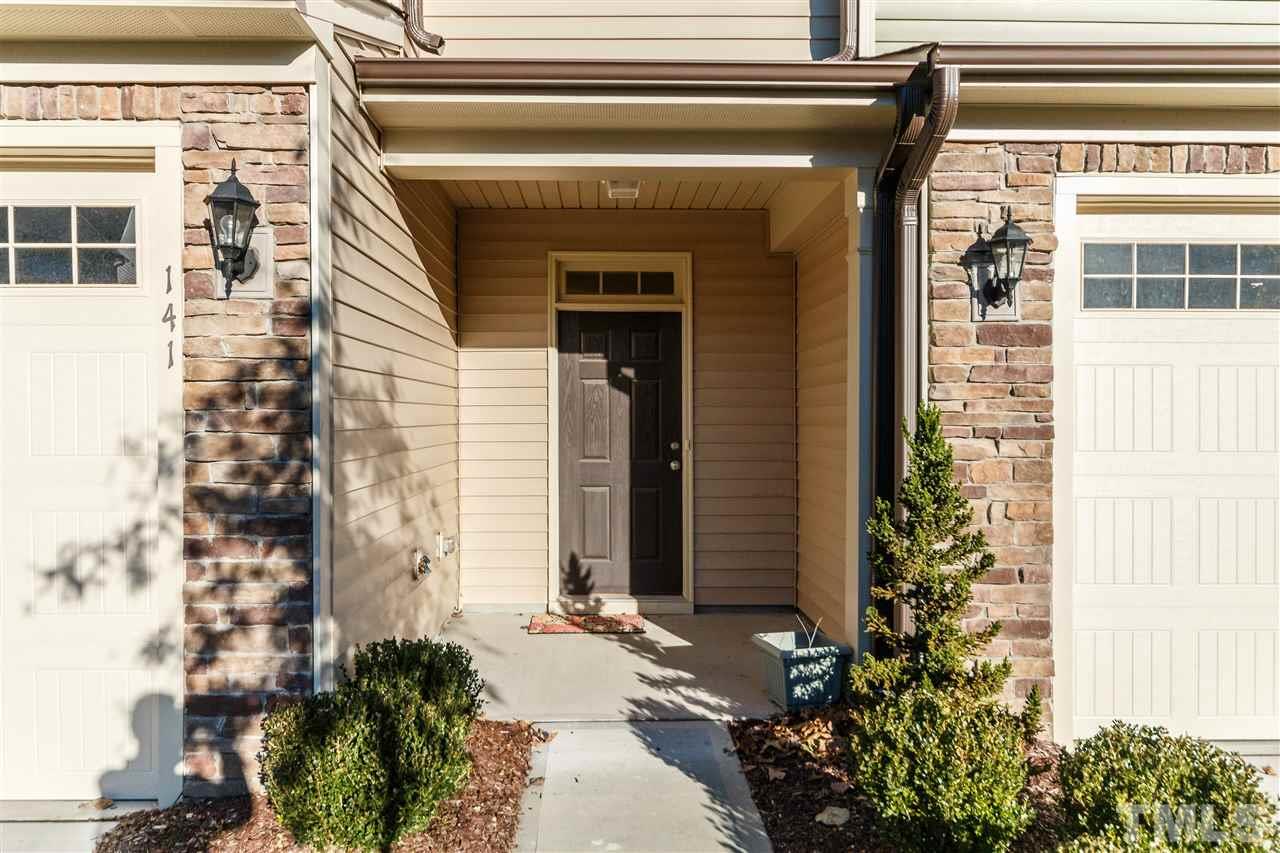 141 Token House Road Durham, NC 27703 - Photo 2 of 22 Covered Entry with stone and vinyle facade.