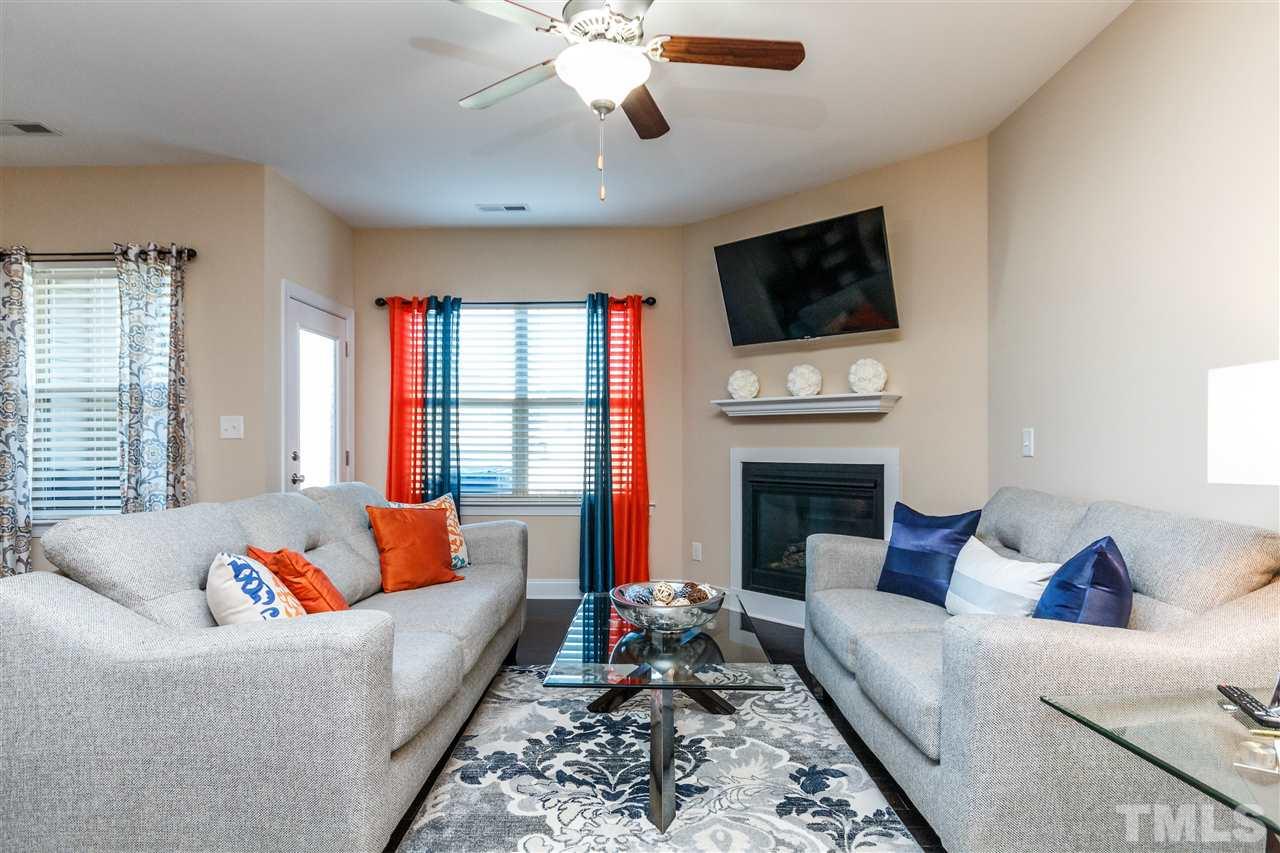 141 Token House Road Durham, NC 27703 - Photo 7 of 22 Centerpiece gas log fireplace. Flowing hardwood flooring. Great space to realx and unwind from the day.