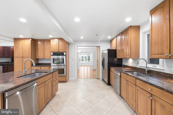 a kitchen with a sink and a refrigerator