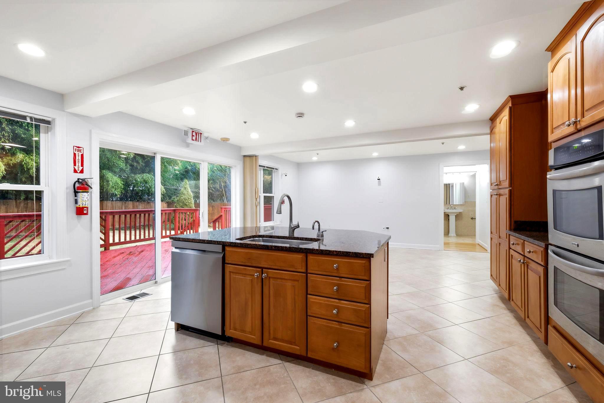 711 Lamberton Drive Silver Spring, MD 20902 - Photo 13 of 60 a kitchen with a sink and cabinets