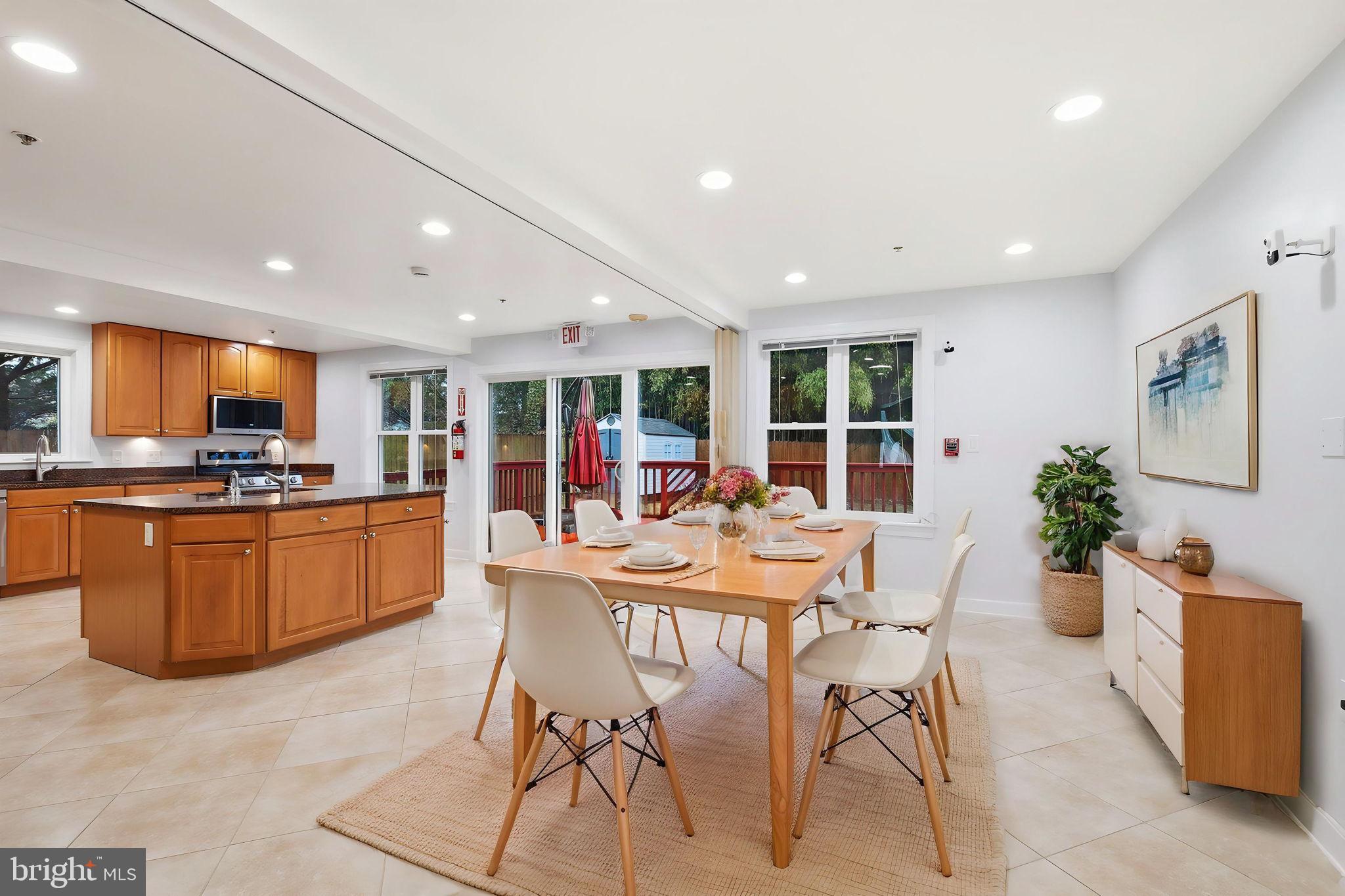 711 Lamberton Drive Silver Spring, MD 20902 - Photo 20 of 60 a view of a dining room with furniture window and wooden floor