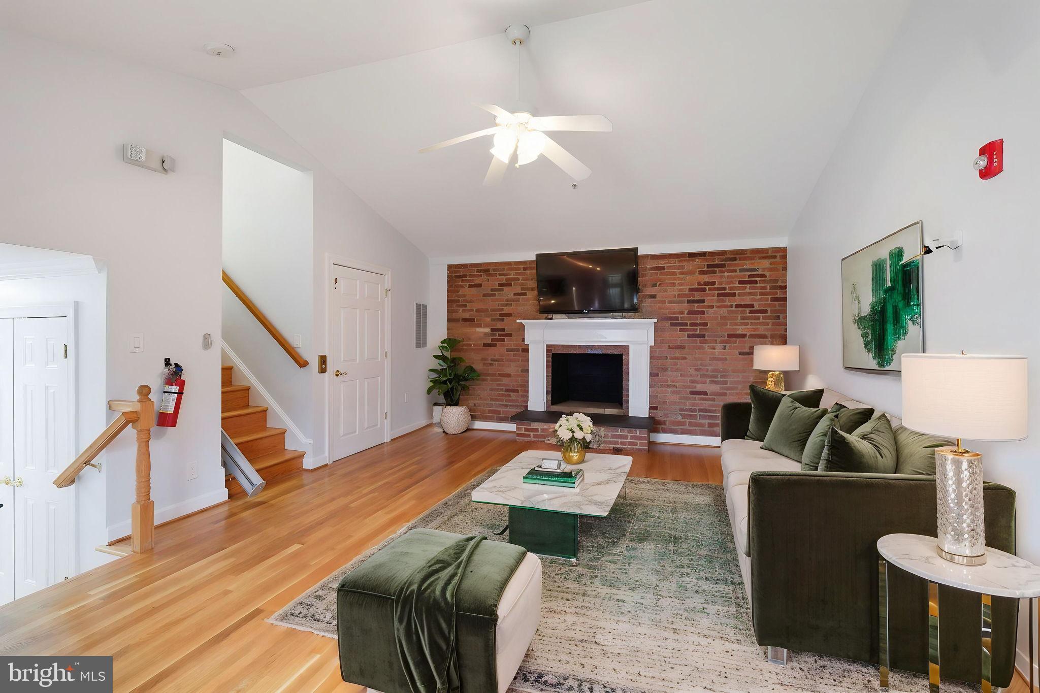 711 Lamberton Drive Silver Spring, MD 20902 - Photo 27 of 60 a living room with furniture and a fireplace