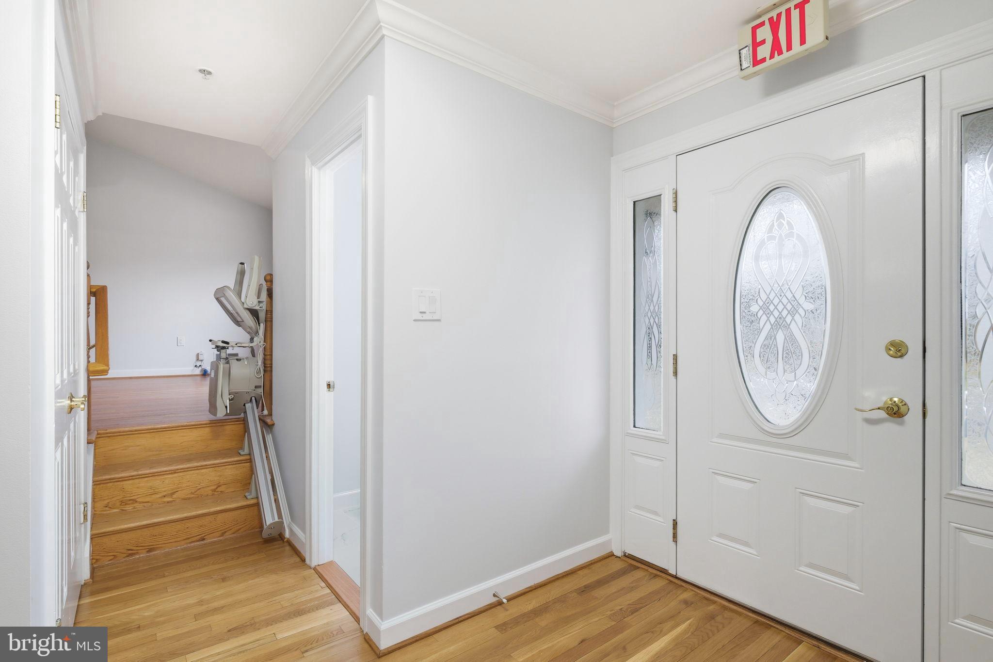 711 Lamberton Drive Silver Spring, MD 20902 - Photo 3 of 60 a view of a hallway with wooden floor and entryway
