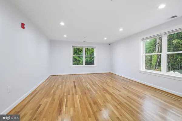 a bathroom with a sink vanity granite and toilet