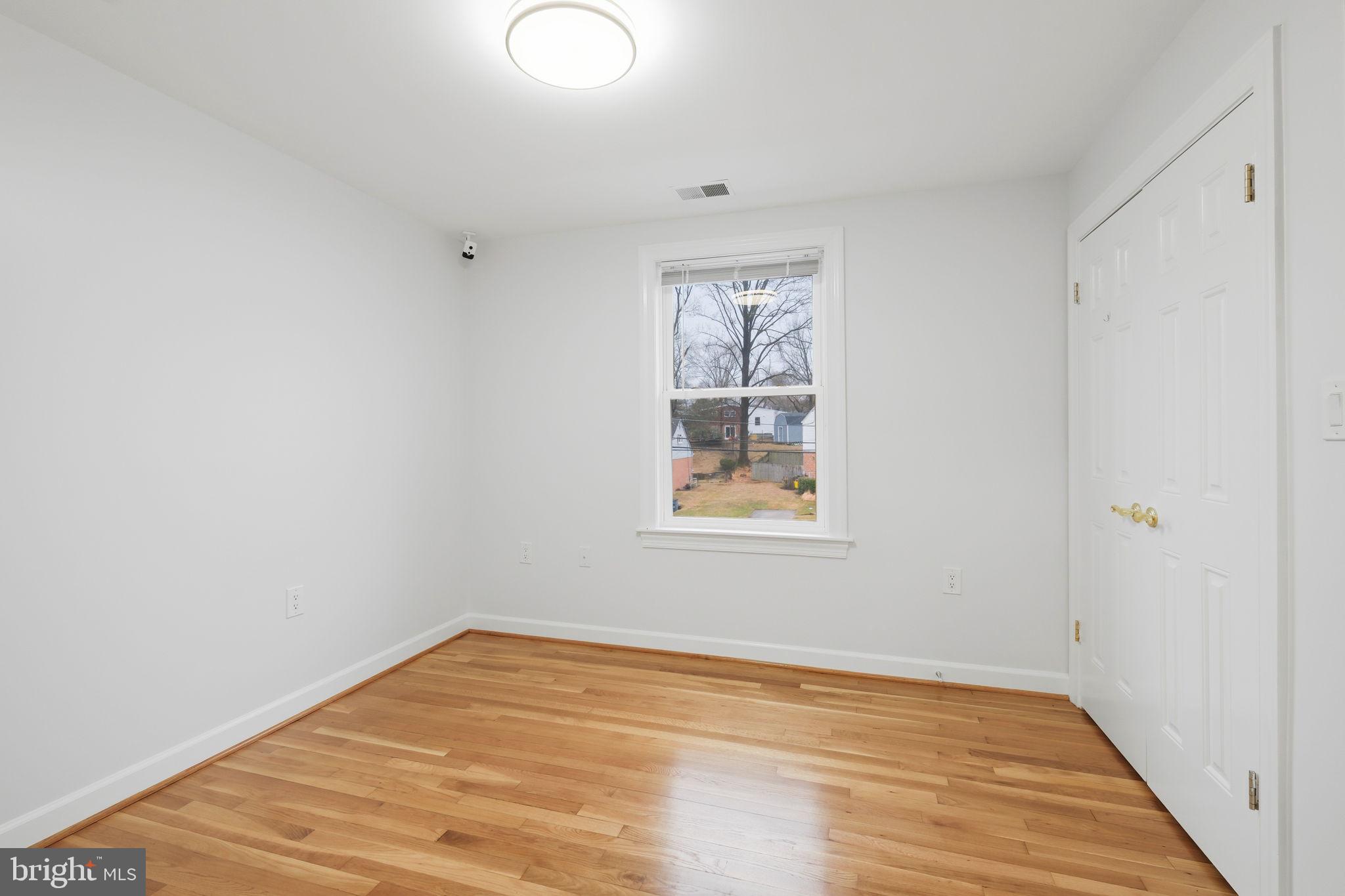 711 Lamberton Drive Silver Spring, MD 20902 - Photo 38 of 60 a view of empty room with wooden floor