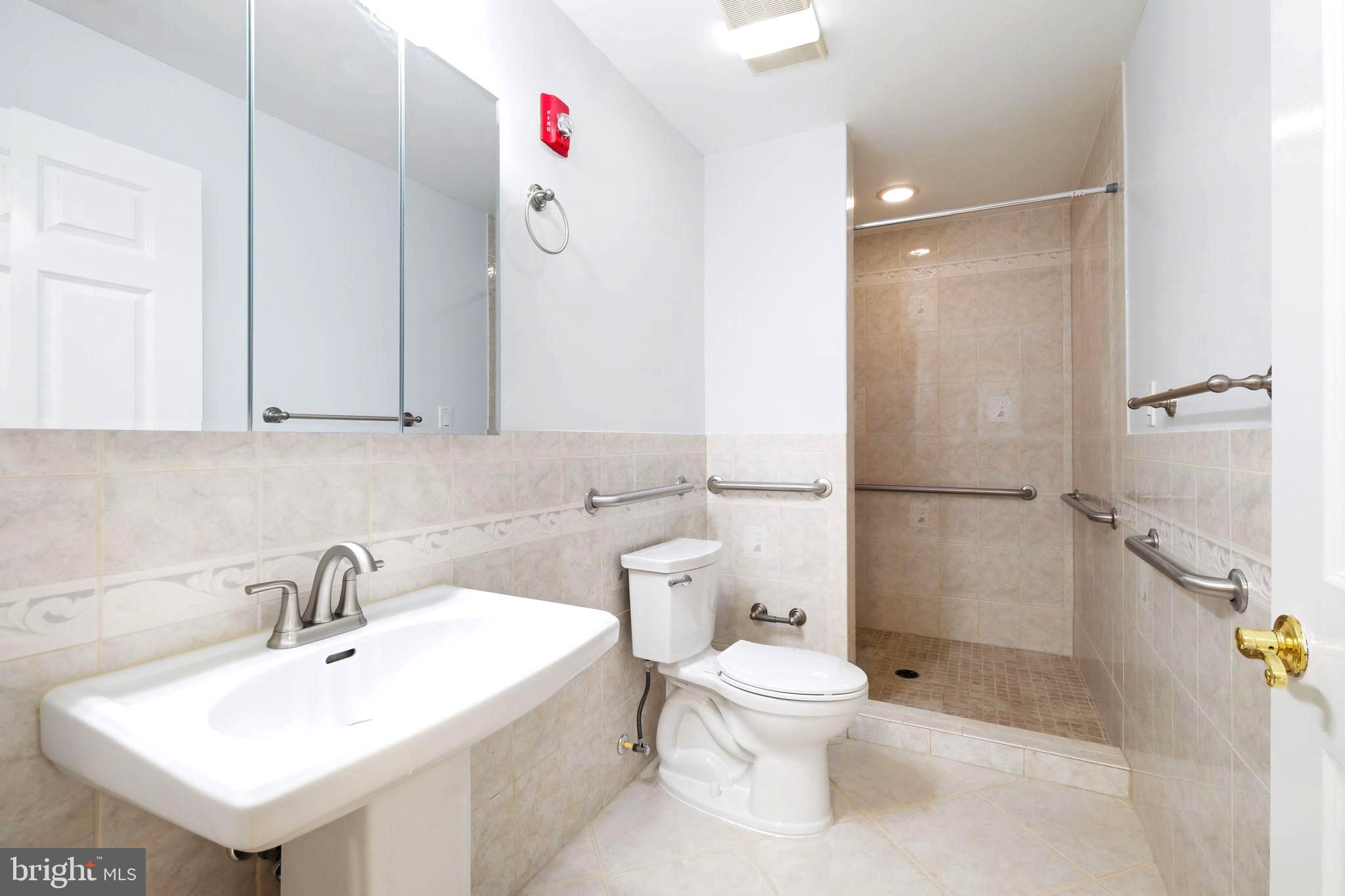 711 Lamberton Drive Silver Spring, MD 20902 - Photo 42 of 60 a bathroom with a sink toilet and shower