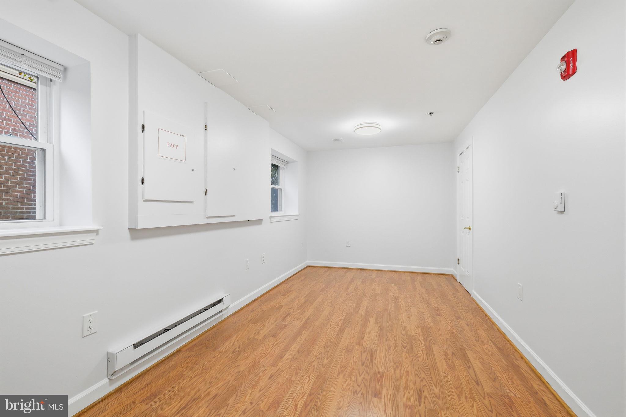 711 Lamberton Drive Silver Spring, MD 20902 - Photo 43 of 60 a view of empty room with wooden floor