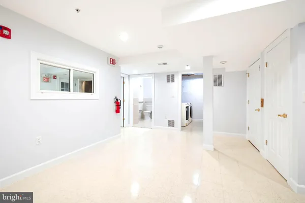 a view of a house with a wooden deck and a yard