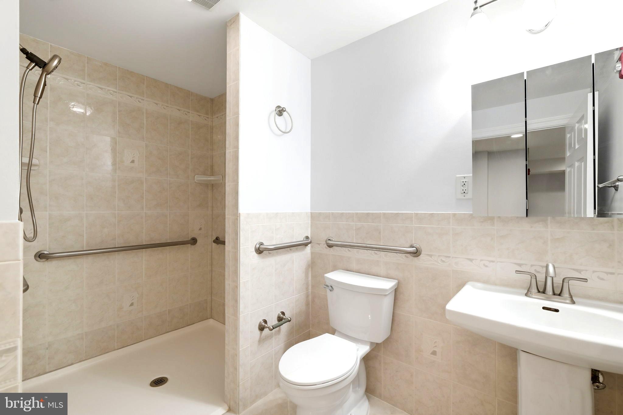 711 Lamberton Drive Silver Spring, MD 20902 - Photo 47 of 60 a bathroom with a sink toilet and shower