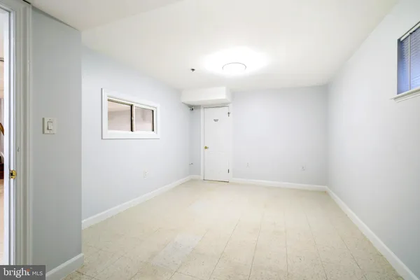 a picture of a bench in front of a window