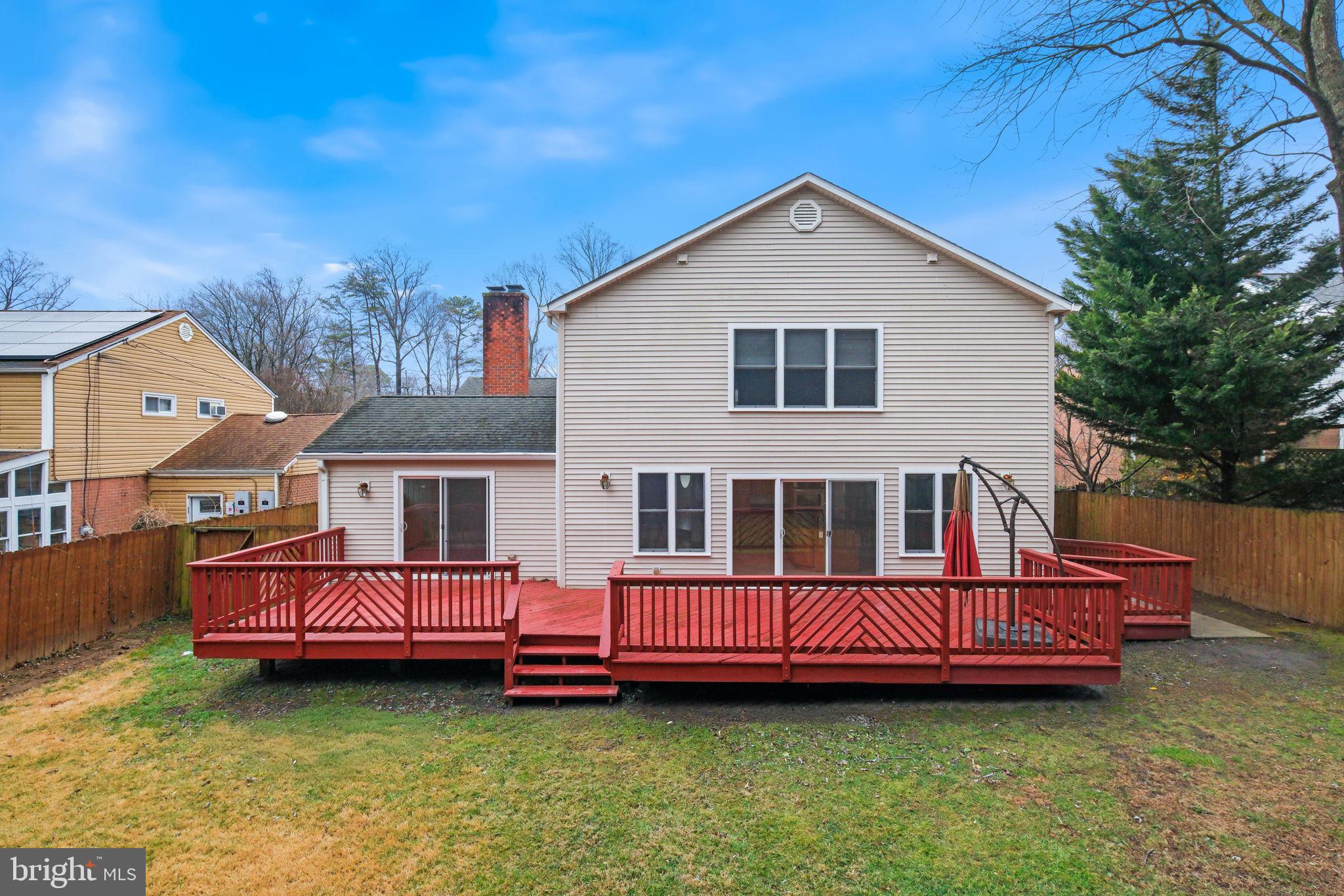 711 Lamberton Drive Silver Spring, MD 20902 - Photo 55 of 60 a view of a house with a backyard and deck