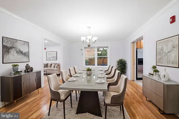 a view of livingroom with chandelier and wooden floor