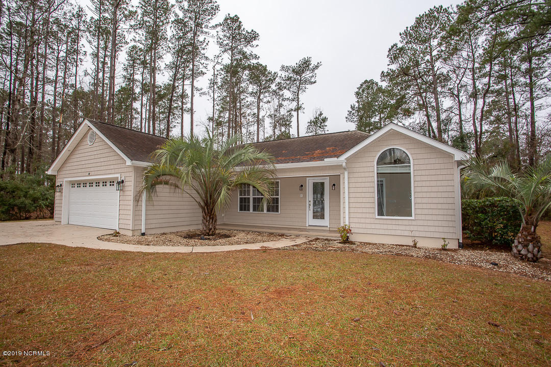 69 Persimmon Road Southwest Carolina Shores, NC 28467 - Photo 1 of 40 A22A1002