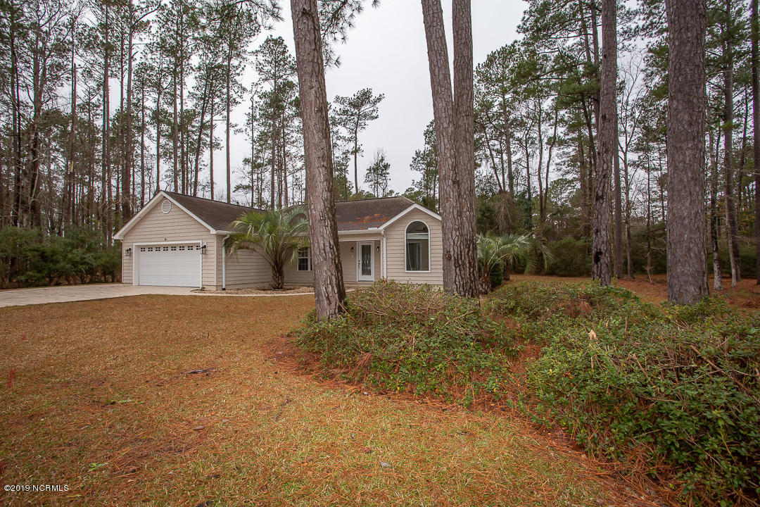 69 Persimmon Road Southwest Carolina Shores, NC 28467 - Photo 2 of 40 A22A1000