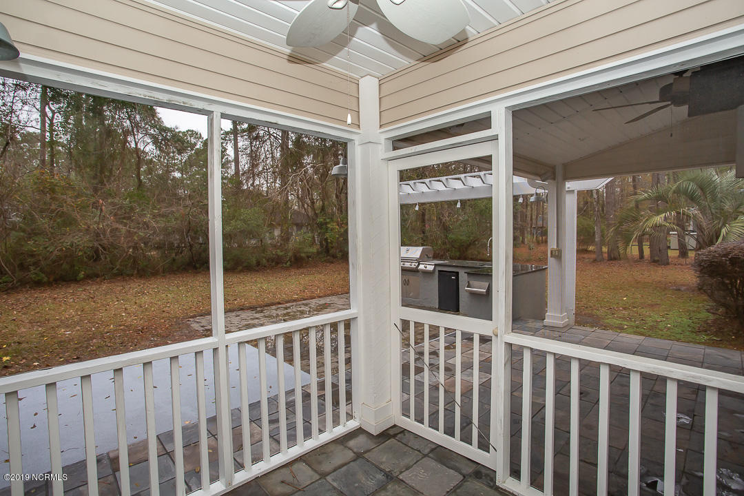 69 Persimmon Road Southwest Carolina Shores, NC 28467 - Photo 28 of 40 Screen porch off master
