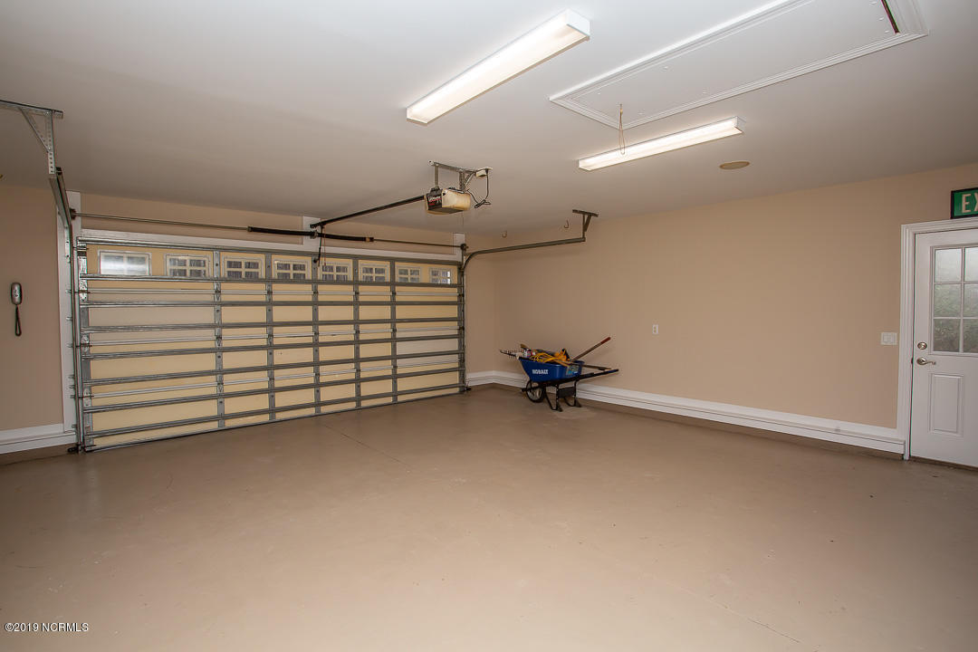 69 Persimmon Road Southwest Carolina Shores, NC 28467 - Photo 31 of 40 OVERSIZED 2 CAR GARAGE W/RESURFACED FLOOR AND FINISHED WALLS/HURRICANE DOOR