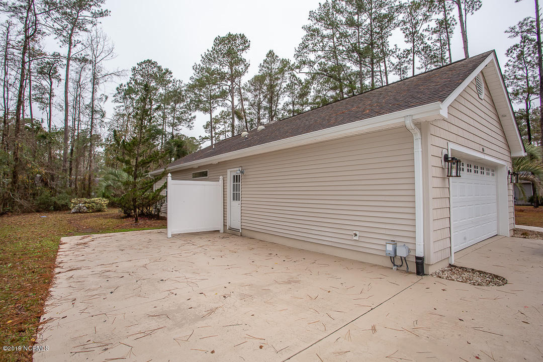 69 Persimmon Road Southwest Carolina Shores, NC 28467 - Photo 39 of 40 PAD ON SIDE OF GARAGE