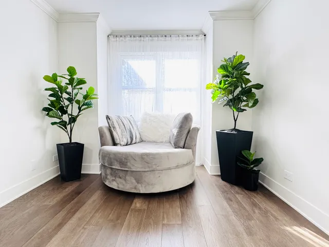 a spacious bathroom with a granite countertop sink mirror and shower