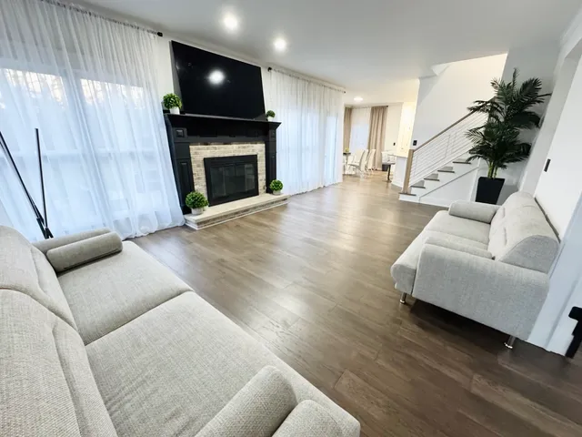 a view of a living room and hardwood floor