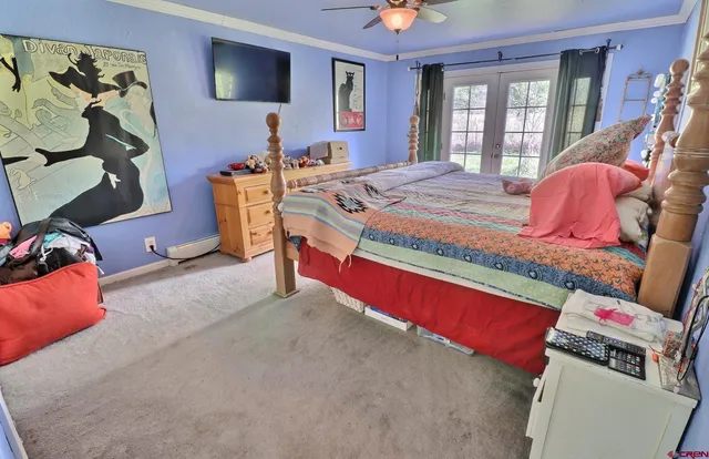 a bed room with a bed and a tv